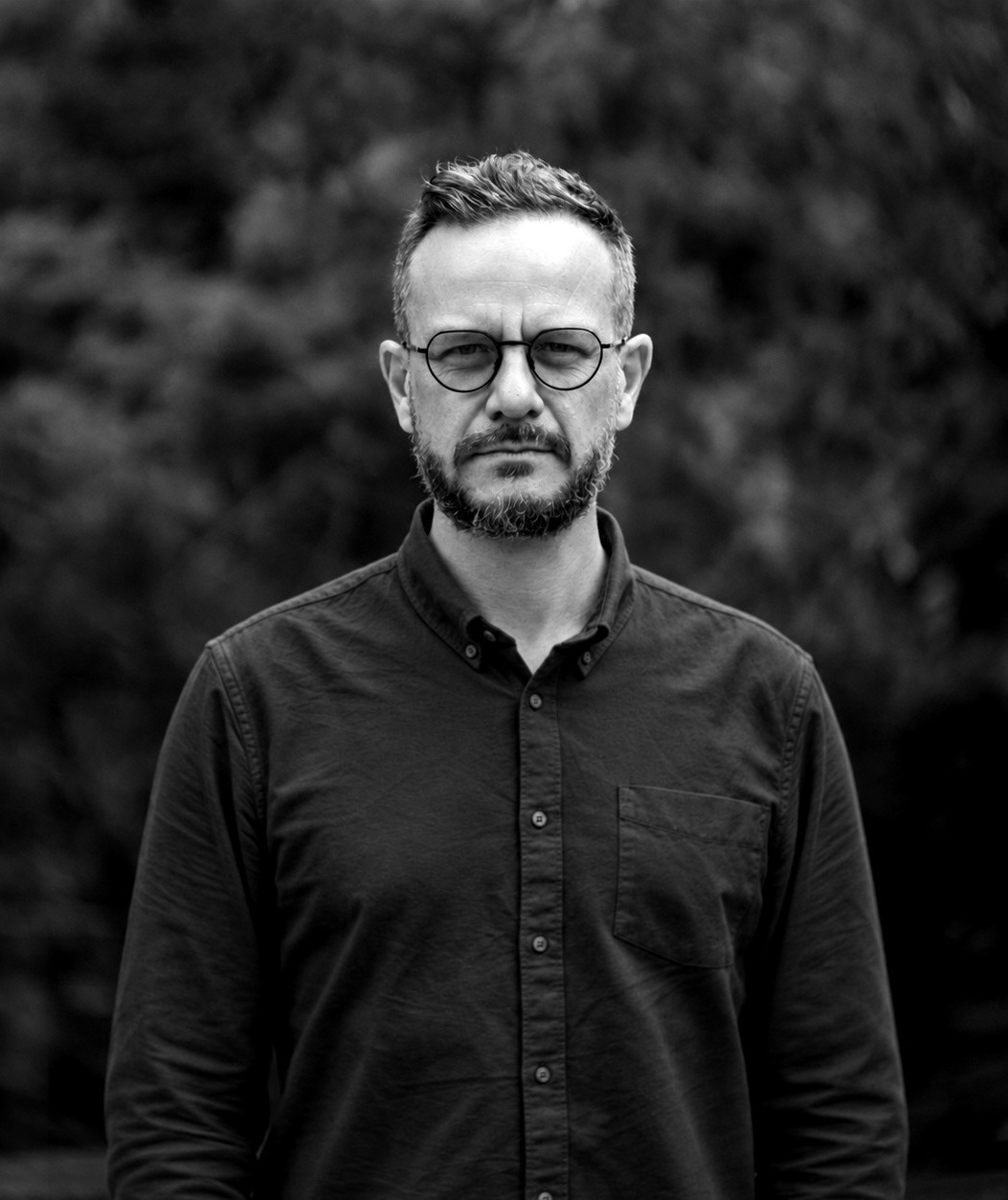 JH Beetge, in black and white, looking into the camera.